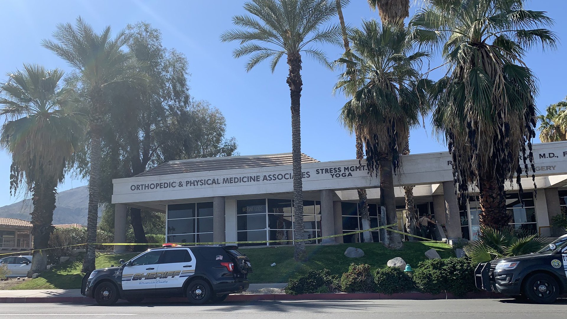 Deputies respond to the scene where two men were found dead in a Rancho Mirage medical office on Feb. 14, 2020, in a photo provided by the Riverside County Sheriff's Department.