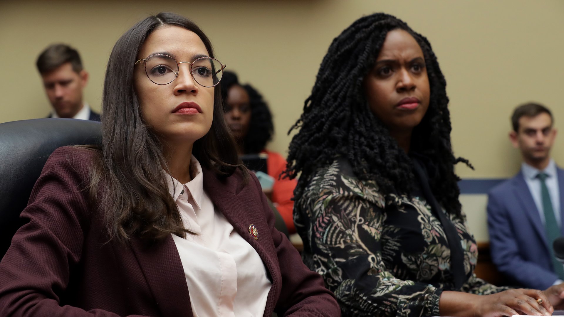 Reps. Alexandria Ocasio-Cortez (left) and Ayanna Pressley attend a Capitol Hill hearing on drug pricing on July 26, 2019. (Credit: Chip Somodevilla / Getty Images)