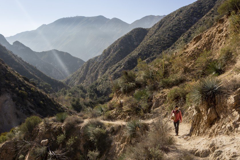 Bryan Matsumoto, program organizer for Nature For All, hikes the Trail Canyon Falls trail in the western San Gabriel Mountains in this undated photo. (Credit: Gabriella Angotti-Jones / Los Angeles Times)