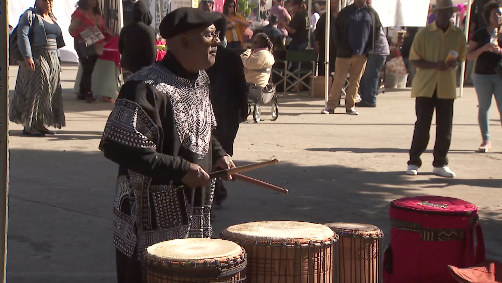 A man plays the drums during a Black History Month celebration in Leimert Park on Feb. 16, 2020.