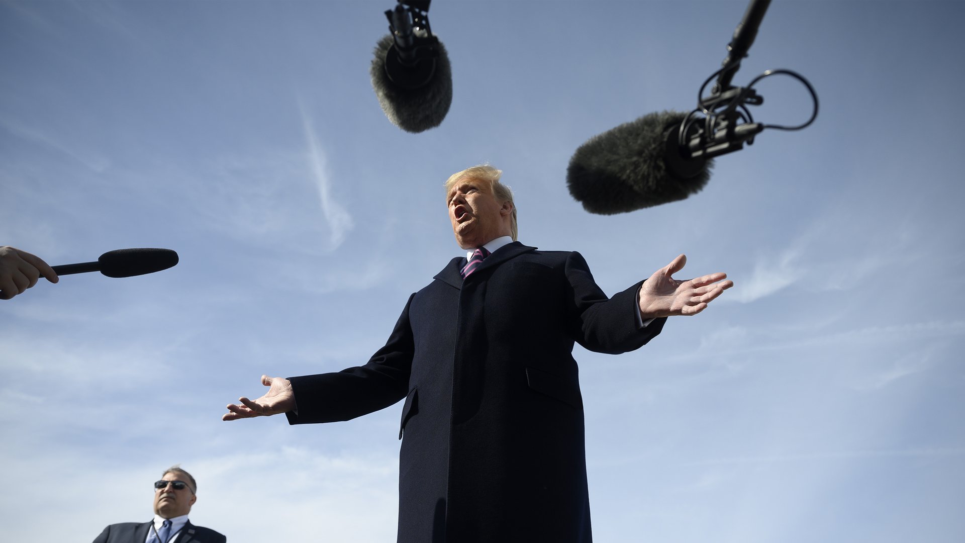 President Donald Trump speaks to the press before boarding Air Force One at Join Base Andrews in Maryland, en route to Los Angeles, on Feb. 18, 2020. (Credit: Jim Watson / AFP / Getty Images)