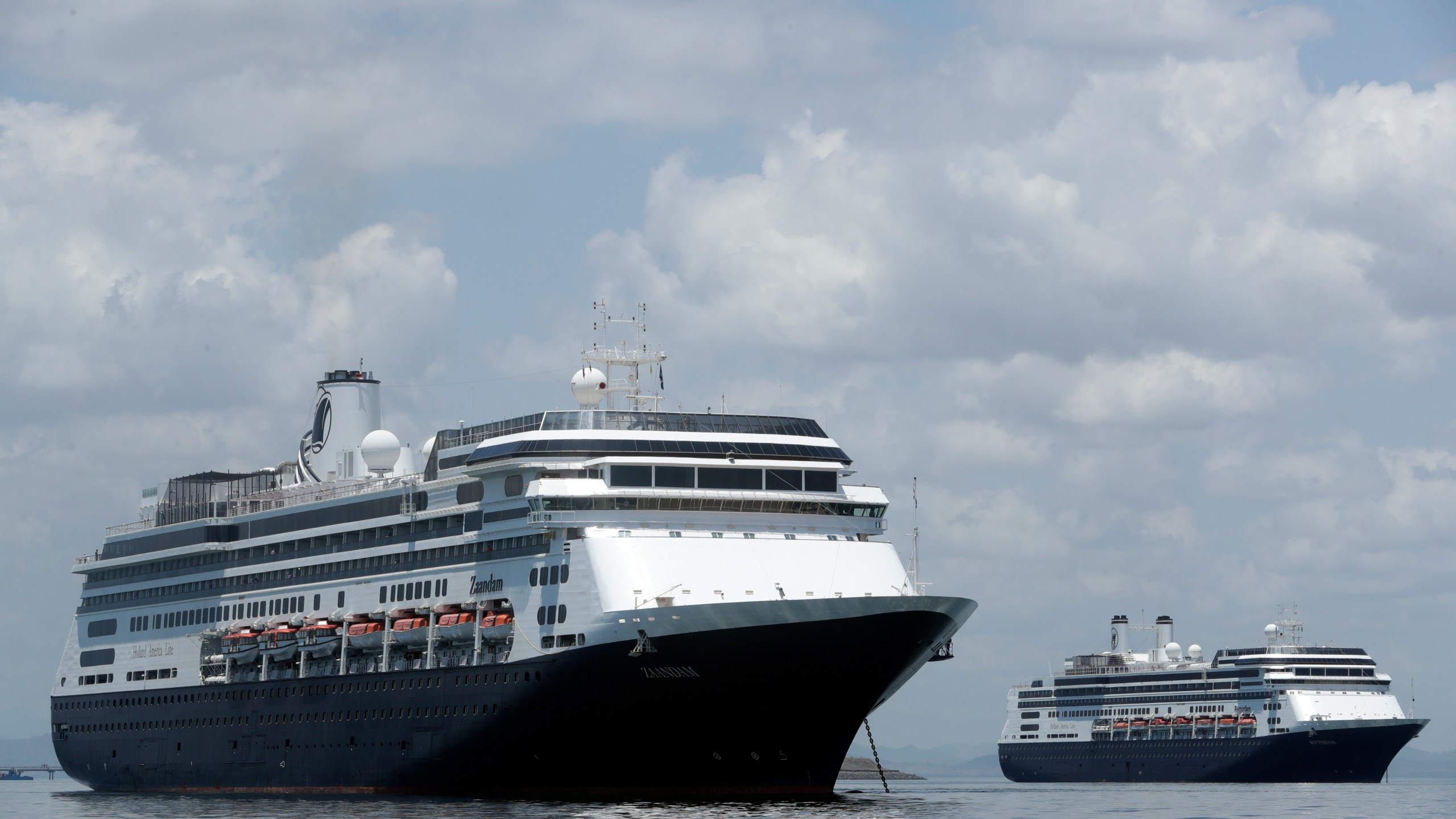 The Zaandam cruise ship, left, carrying guests with flu-like symptoms, is anchored shortly after it arrived in the bay of Panama City on Friday. (AP Photo/Arnulfo Franco)