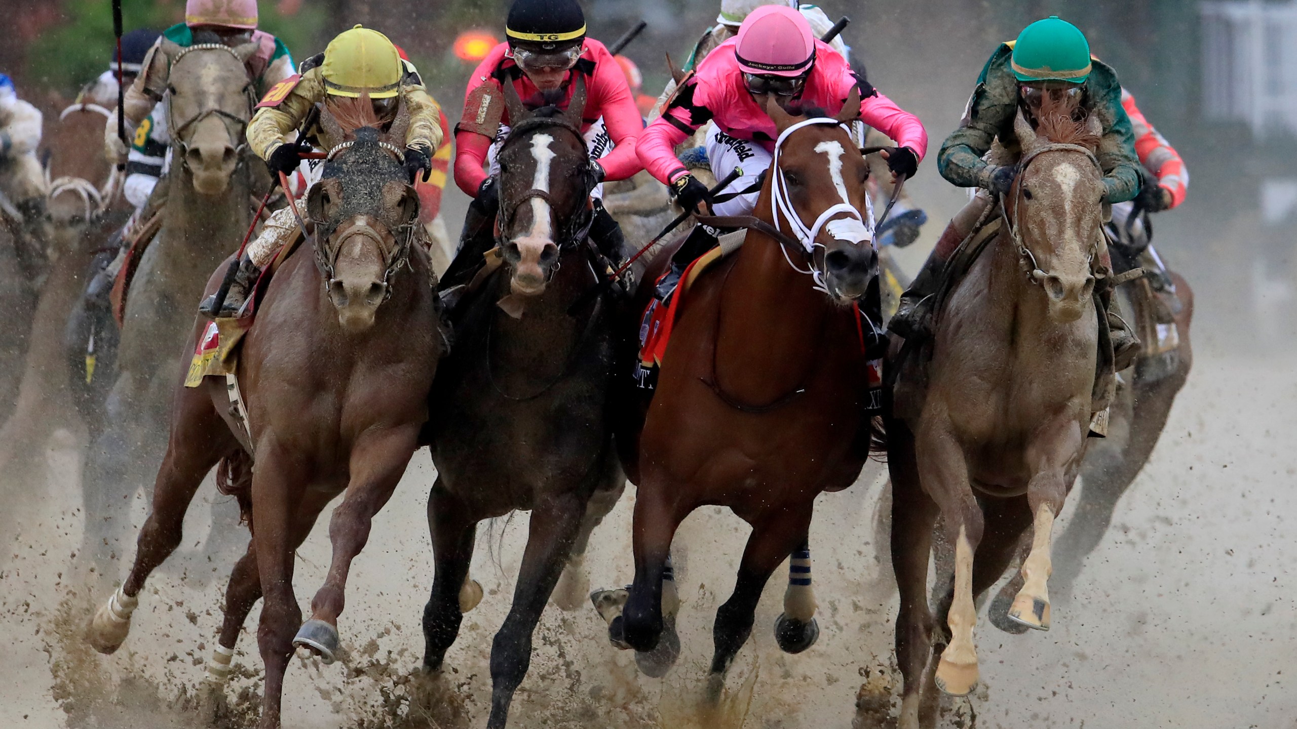 Country House, War of Will, Maximum Security and Code of Honor fight for position in the final turn during the 145th running of the Kentucky Derby in Louisville on May 4, 2019. (Credit: Andy Lyons / Getty Images)