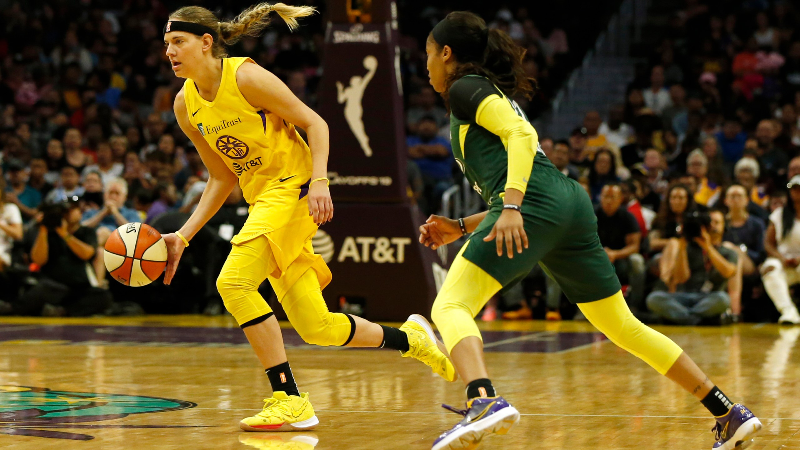 Guard Sydney Wiese #24 of the Los Angeles Sparks drives around guard Jordin Canada #21 of the Seattle Storm at Staples Center on Sept. 15, 2019. in Los Angeles. (Katharine Lotze/Getty Images)