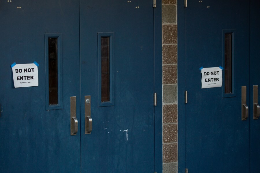 Do not enter signs are seen taped to doors at Bothell High School on Feb. 27, 2020 in Bothell, Washington. (David Ryder/Getty Images)