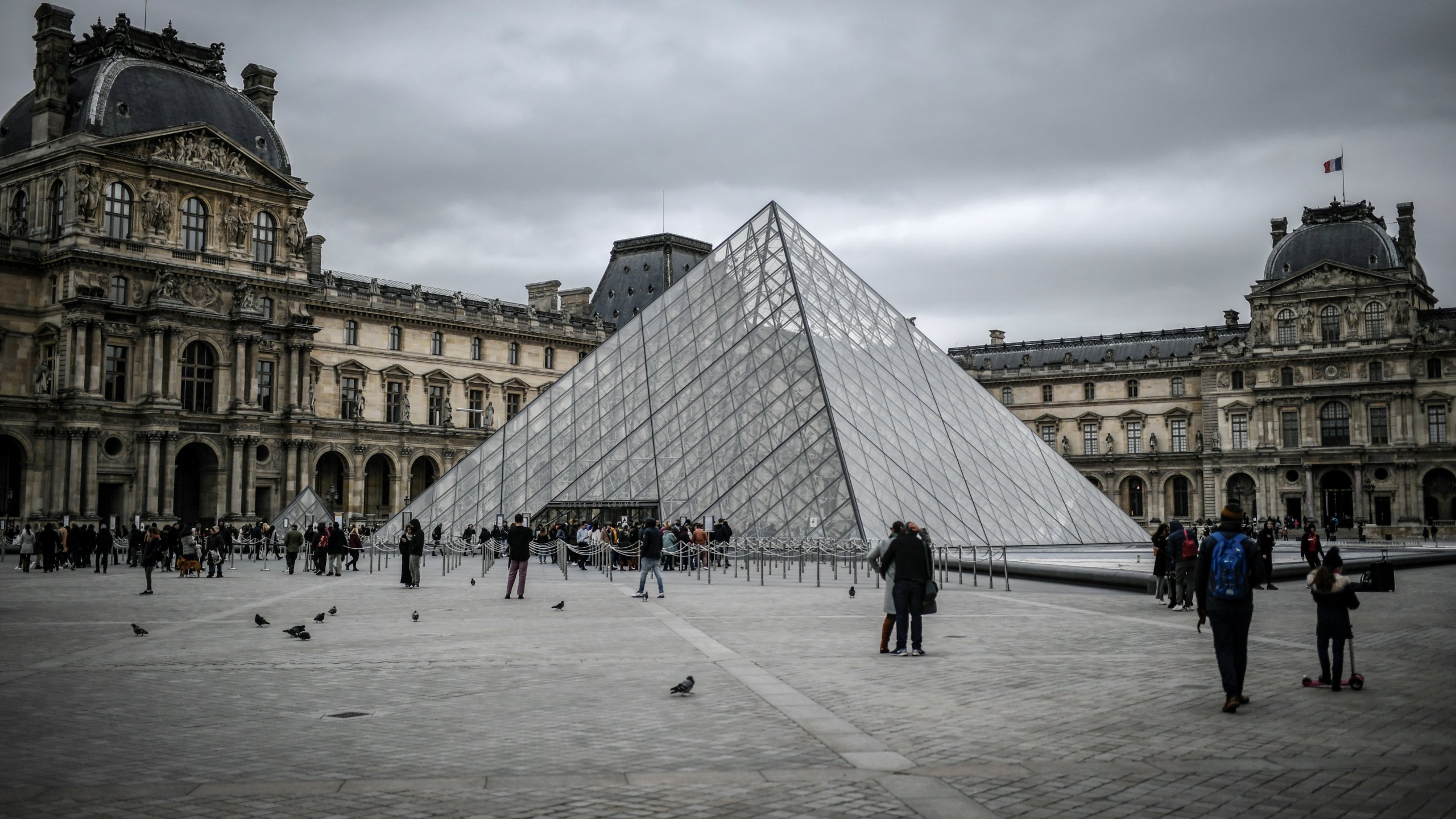 People visit the Louvre on Feb. 28, 2020 in Paris. (STEPHANE DE SAKUTIN/AFP via Getty Images)