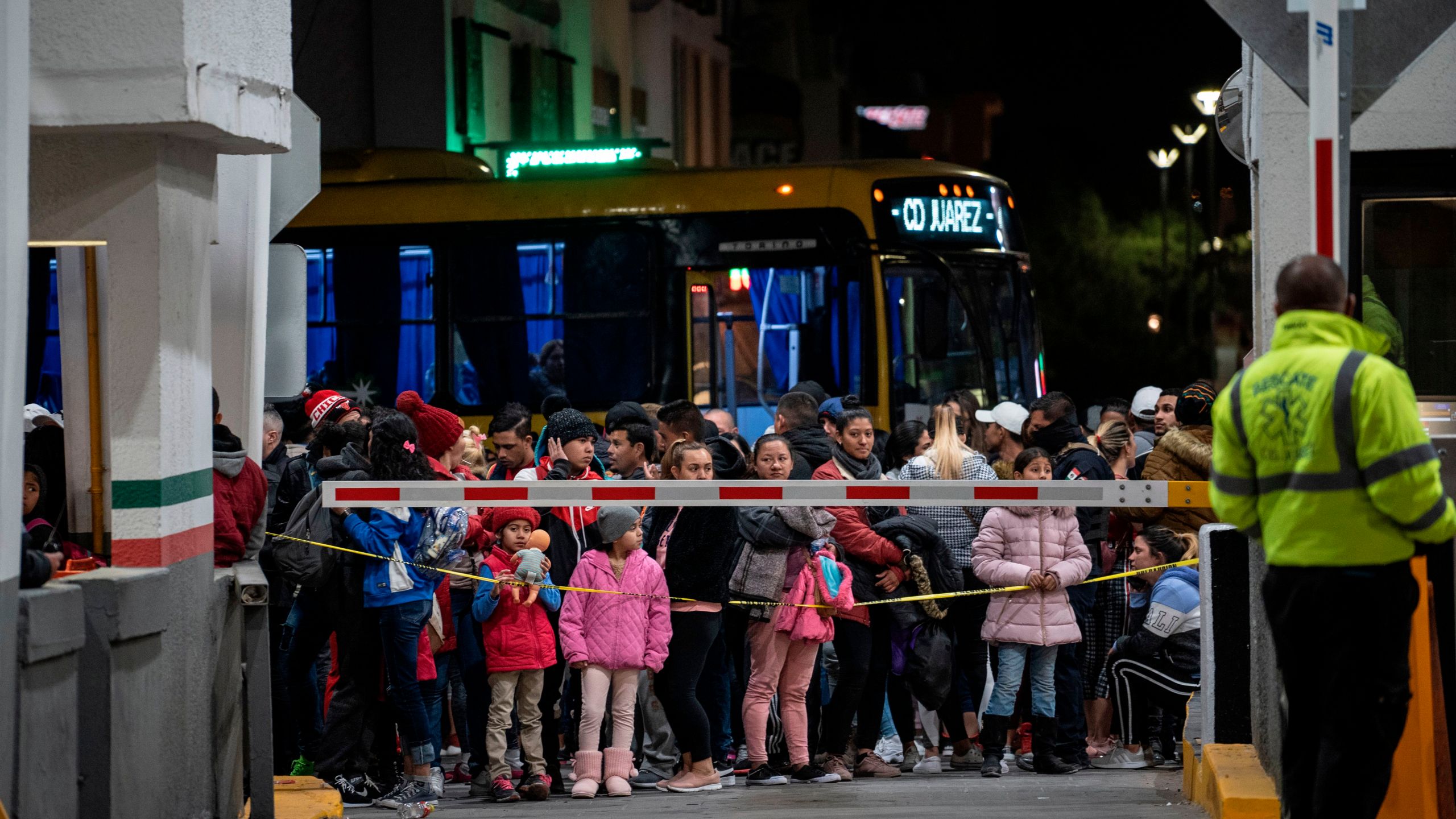 Migrants part of the Remain in Mexico policy wait at the entrance to the Paso del Norte International Bridge on Feb. 28, 2020, in Ciudad Juárez. (Paul Ratje/AFP via Getty Images)