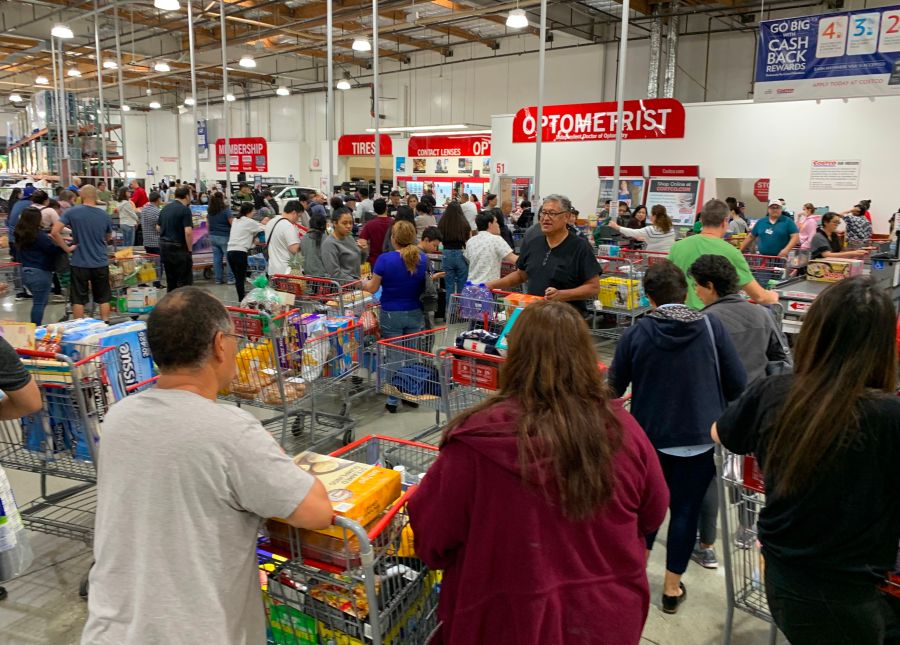 Shoppers buy toilet paper, food and water at a Los Angeles Costco, as people begin to panic buy and stockpile essentials from fear that supplies will be affected by the spread of the coronavirus. (MARK RALSTON/AFP via Getty Images)