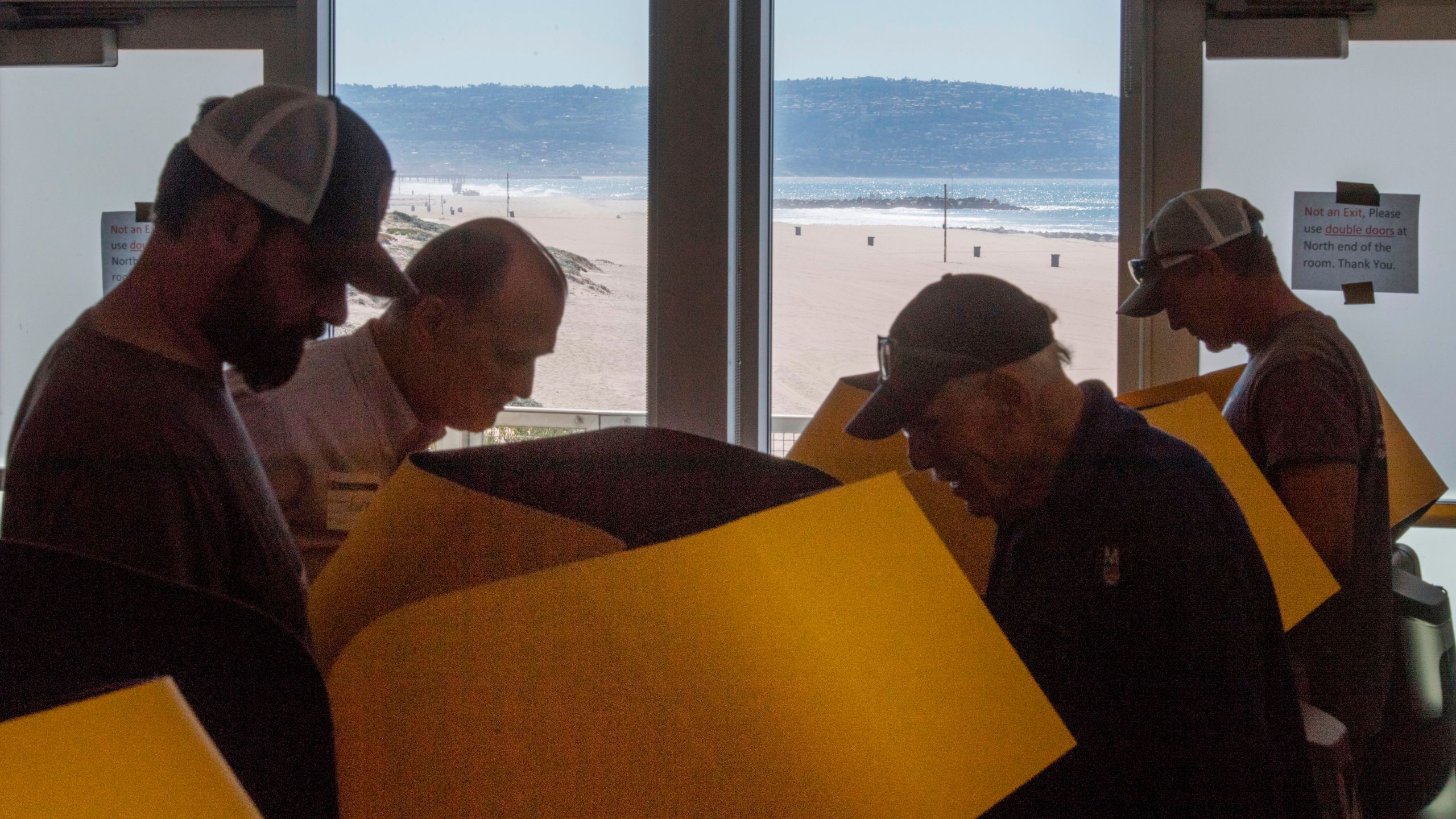 People vote at a beachside vote center in El Segundo during the presidential primary on Super Tuesday, March 3, 2020. (Credit: Mark Ralston / AFP / Getty Images)