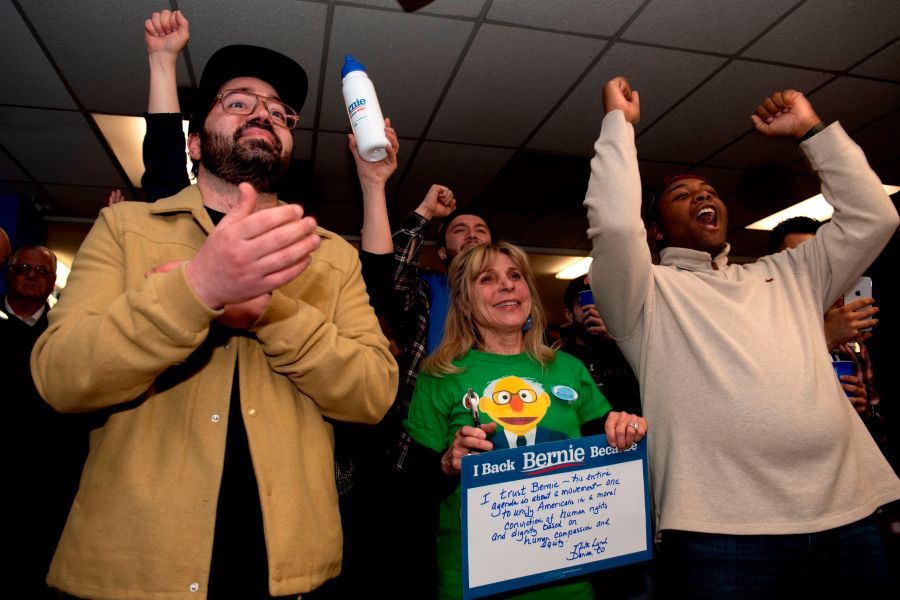 Supporters cheer as they watch a televised address from Democratic presidential candidate Vermont Sen. Bernie Sanders on Super Tuesday, March 3, 2020, in Denver, Colorado.(JASON CONNOLLY/AFP via Getty Images)