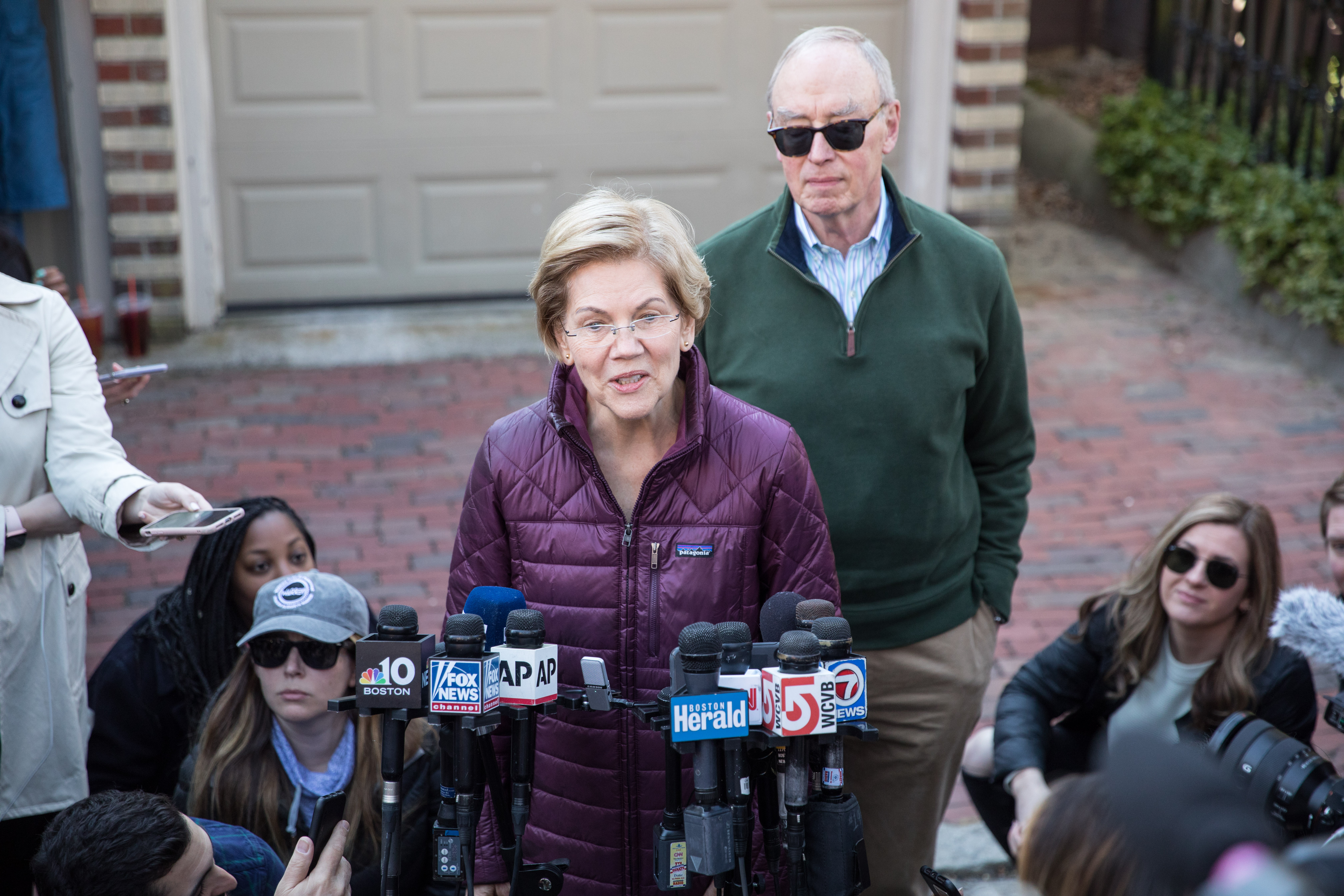 Sen. Elizabeth Warren (D-MA), with husband Bruce Mann, announces that she is dropping out of the presidential race during a media availability outside of her home on March 5, 2020 in Cambridge. (Scott Eisen/Getty Images)