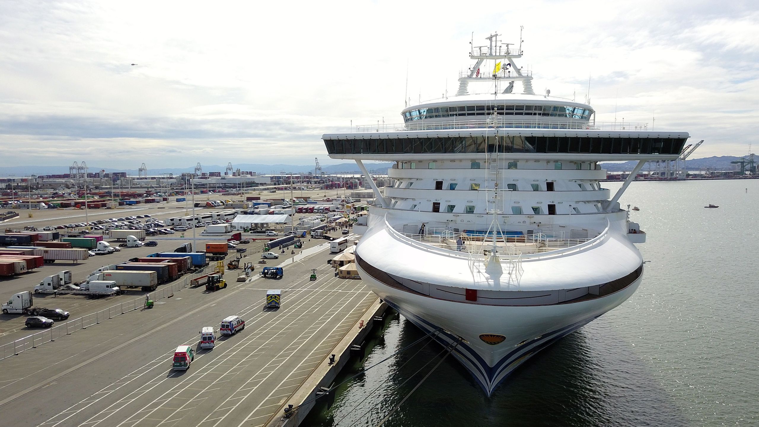 Medical personnel (L) gather in preparation for the disembarkation of passengers aboard the Grand Princess cruise ship at the Port of Oakland in California on March 9, 2020. (JOSH EDELSON/AFP via Getty Images)