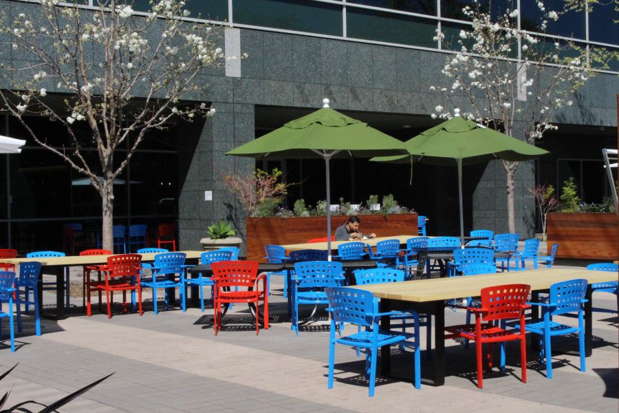 A Google employee eats alone in the sun at lunch time on March 12, 2020, at the company's main campus in the Silicon Valley city of Mountain View, Calif. (GLENN CHAPMAN/AFP via Getty Images)