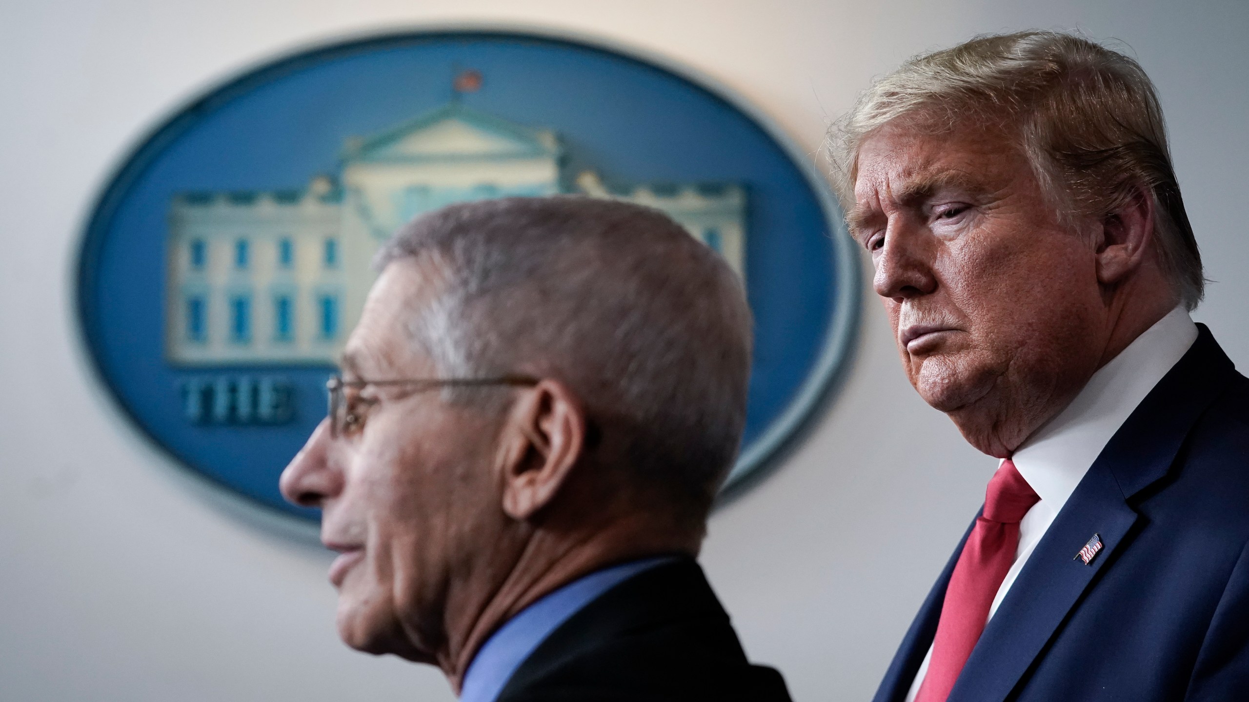 Dr. Anthony Fauci, director of the National Institute of Allergy and Infectious Diseases, speaks as President Donald Trump looks on during a briefing on the coronavirus pandemic, in the press briefing room of the White House on March 24, 2020. (Drew Angerer/Getty Images)