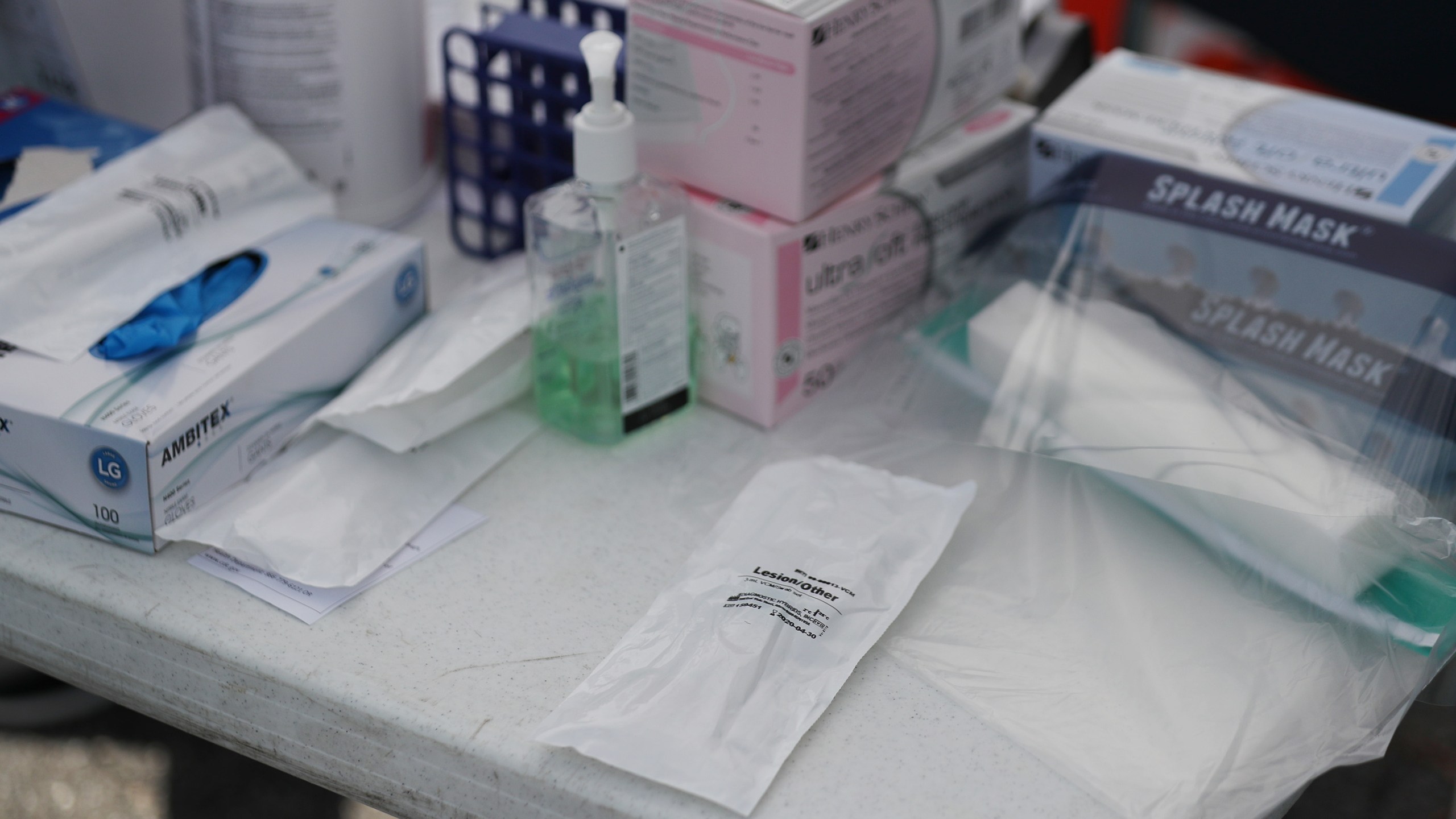 A coronavirus test kit is seen in its protective pouch on a table as health care staff members from the FoundCare center help people who called to setup a drive through appointments to be tested for the coronavirus in the centers parking lot on March 16, 2020 in West Palm Beach, Florida. (Joe Raedle/Getty Images)