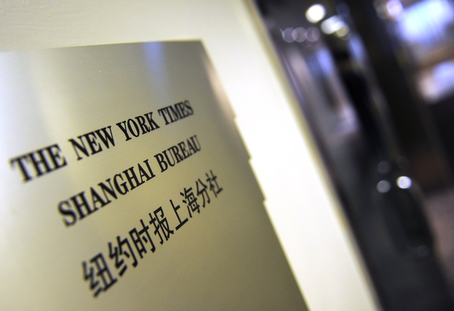 A plaque is seen on the wall outside the New York Times office in Shanghai on Oct. 30, 2012. (PETER PARKS/AFP via Getty Images)