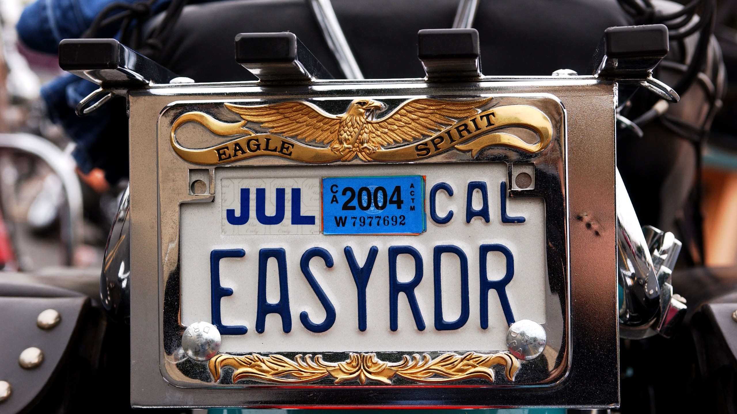 A vanity license plate sits on a Harley-Davidson motorcycle in Glendale on Nov. 9, 2003. (Credit: Amanda Edwards / Getty Images)