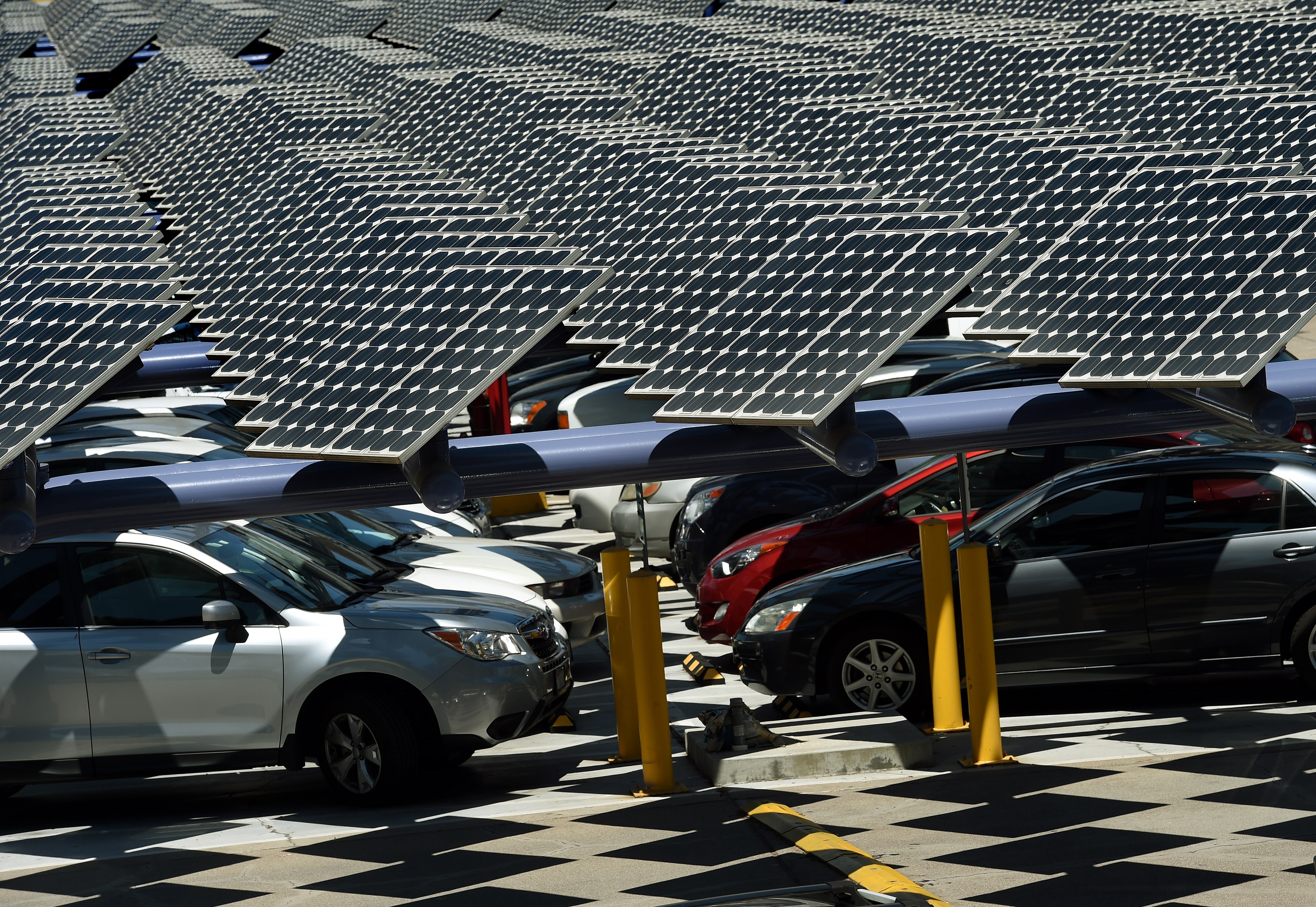 Solar panels used to generate power outside an office building in Los Angeles on Aug. 4, 2015. (MARK RALSTON/AFP via Getty Images)