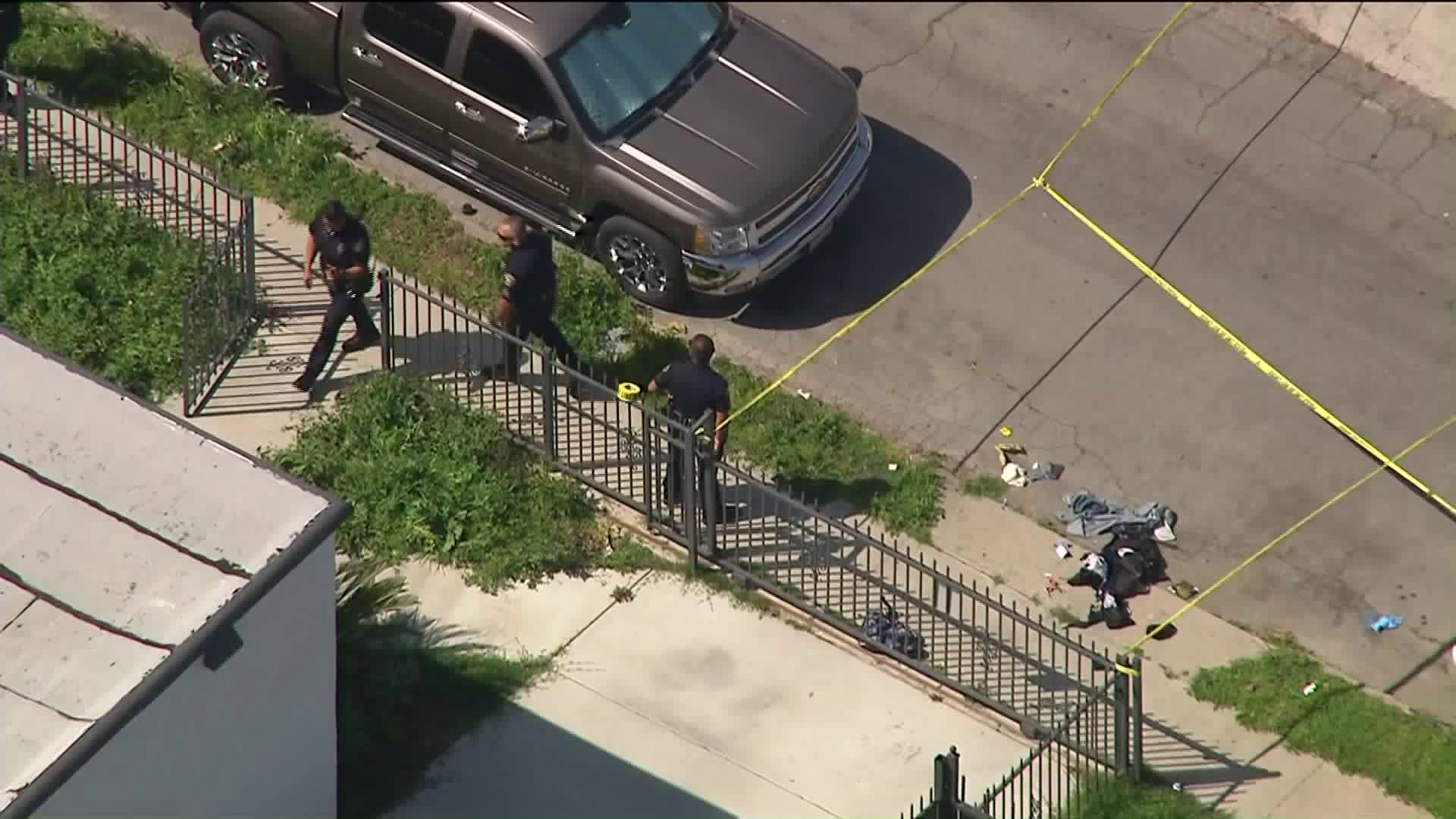 Long Beach Police Department officers work at the scene of an officer-involved shooting on March 30, 2020. (KTLA)