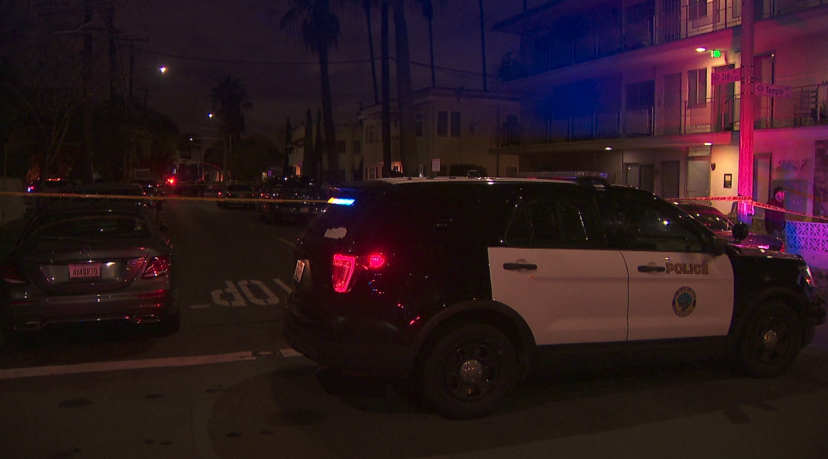 A Long Beach police vehicle is seen in the 200 block of Molino Avenue where an officer fatally shot a woman police said tried to stab her mother on March 15, 2020. (KTLA)