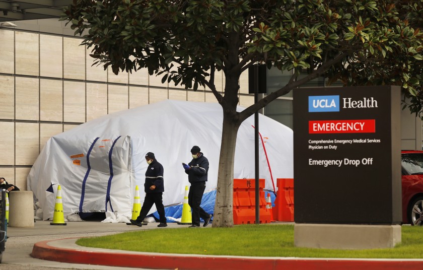 Tents have been erected at the Saperstein Emergency Center entrance to the Ronald Reagan UCLA Medical Center on the Westwood campus as hospitals anticipate a big wave of coronavirus patients.(Al Seib / Los Angeles Times)