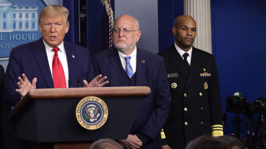 U.S. Surgeon General Jerome Adams, far right, stands besides Centers for Disease Control and Prevention Director Robert Redfield as President Donald Trump discusses the coronavirus outbreak during a news conference at the White House on Feb. 29, 2020. (Alex Wong/Getty Images)