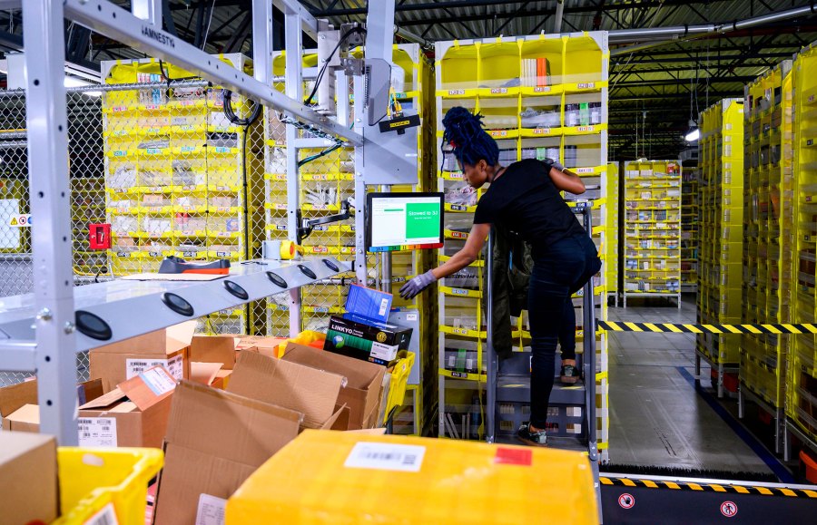 Amazon employees at the company's Staten Island, New York, facility plan to walk off the job Monday amid allegations the online retail giant has mishandled its response to the coronavirus pandemic. (Johannes Eisele/AFP/Getty Images)