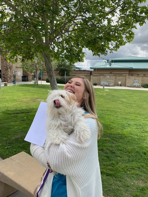 Amy Hutto poses with her new dog in this photo released by Riverside County Animal Services on March 20, 2020.