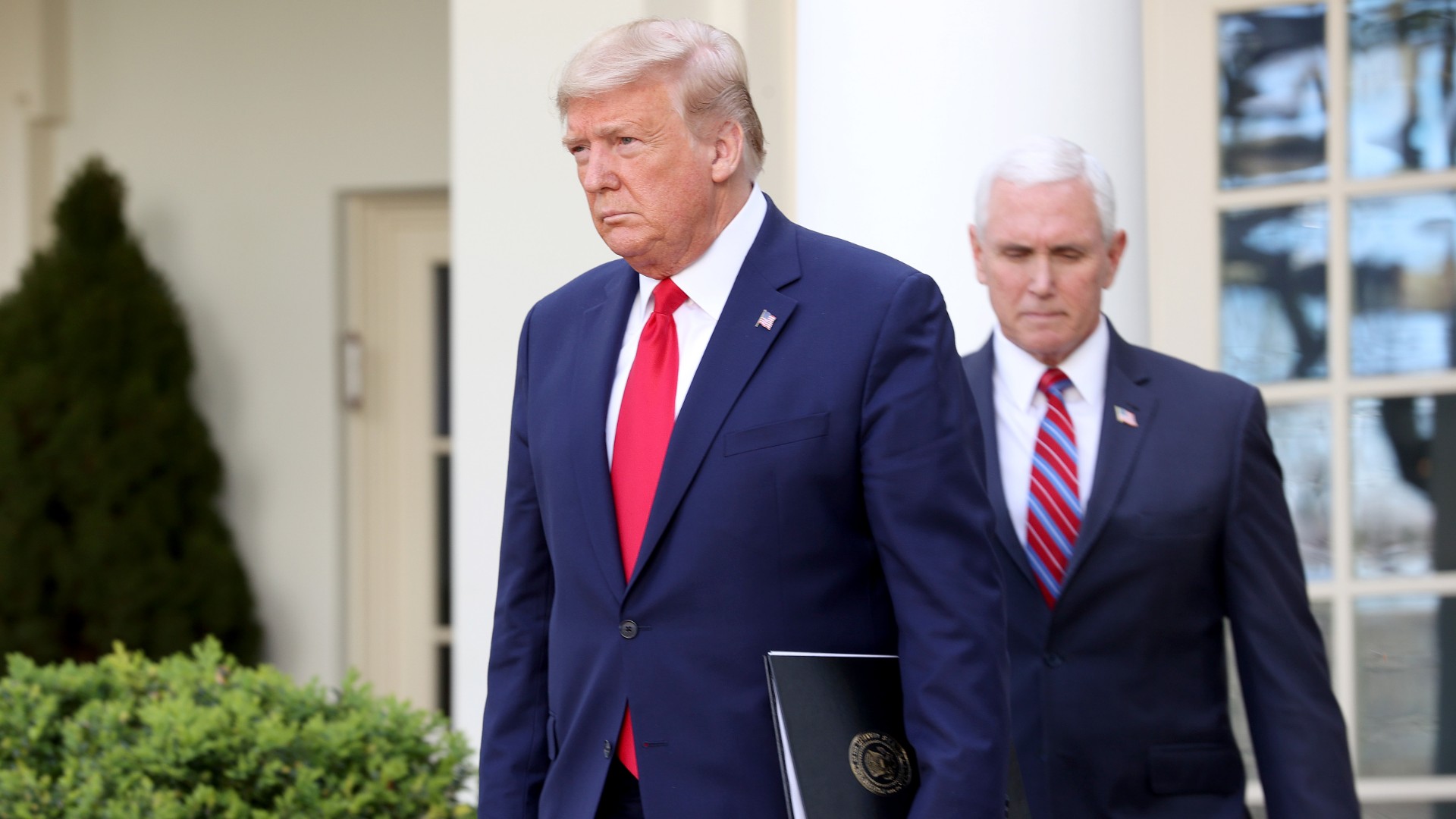 U.S. President Donald Trump and Vice president Mike Pence arrive for the daily coronavirus task force briefing at the Rose Garden of the White House on March 30, 2020 in Washington, DC. (Win McNamee/Getty Images)