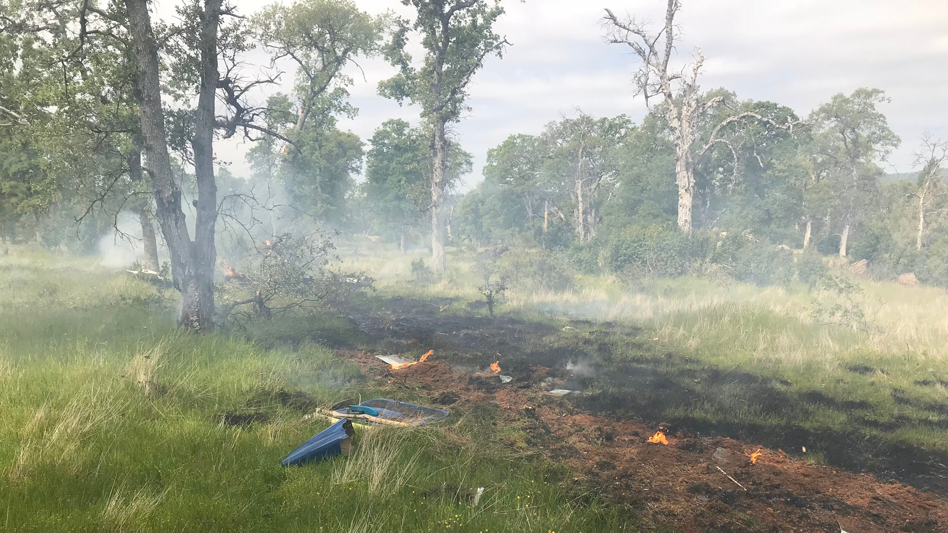 Debris from a plane crash is seen in a field near Auburn Municipal Airport on April 18, 2020. (Placer County Sheriff's Lt. Andrew Scott)