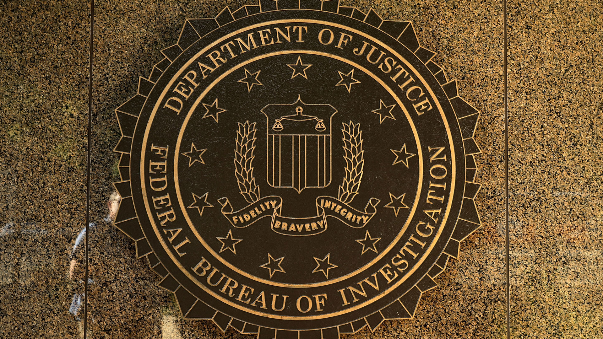 The seal of the Federal Bureau of Investigation hangs on the outside of the bureau's Edgar J. Hoover Building in Washington, D.C. (Photo by Chip Somodevilla/Getty Images)