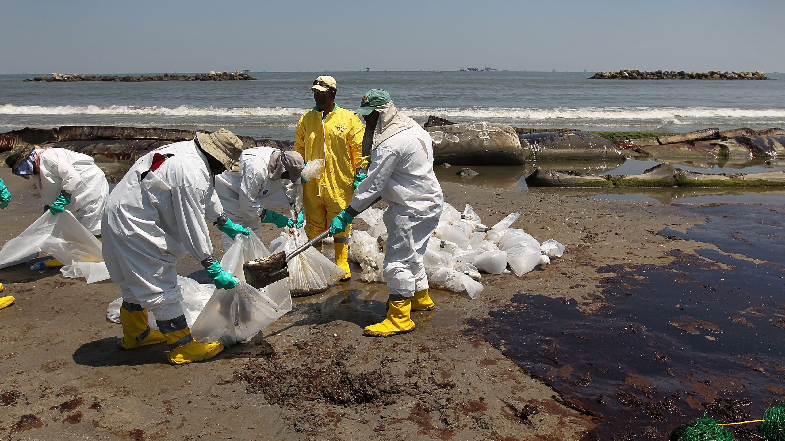 A BP cleanup crew shovels oil from a beach on May 24, 2010 at Port Fourchon, Louisiana. (John Moore/Getty Images)