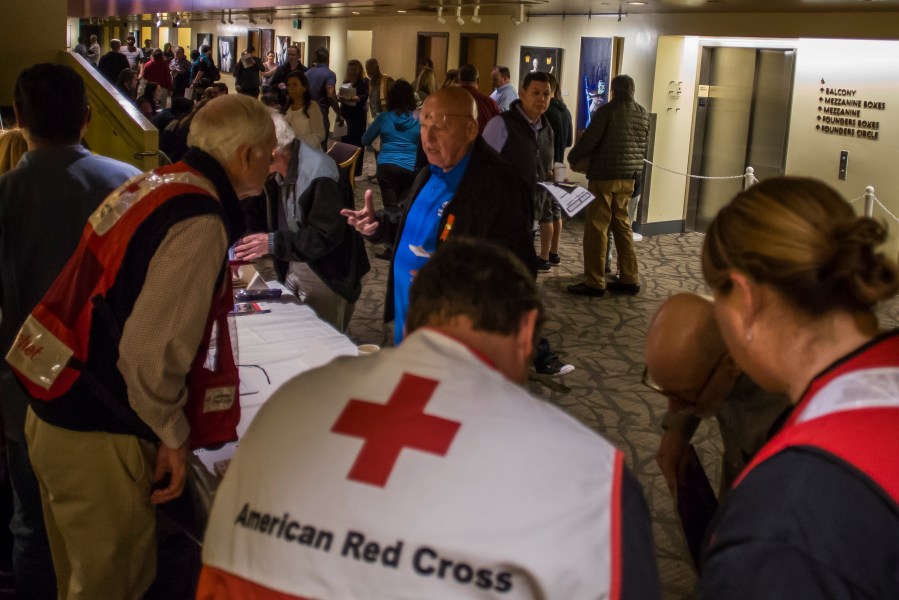 Members of the American Red Cross speak to wildfire victims at a town hall in Thousand Oaks on Nov. 14, 2018. (Credit: Apu Gomes / AFP / Getty Images)