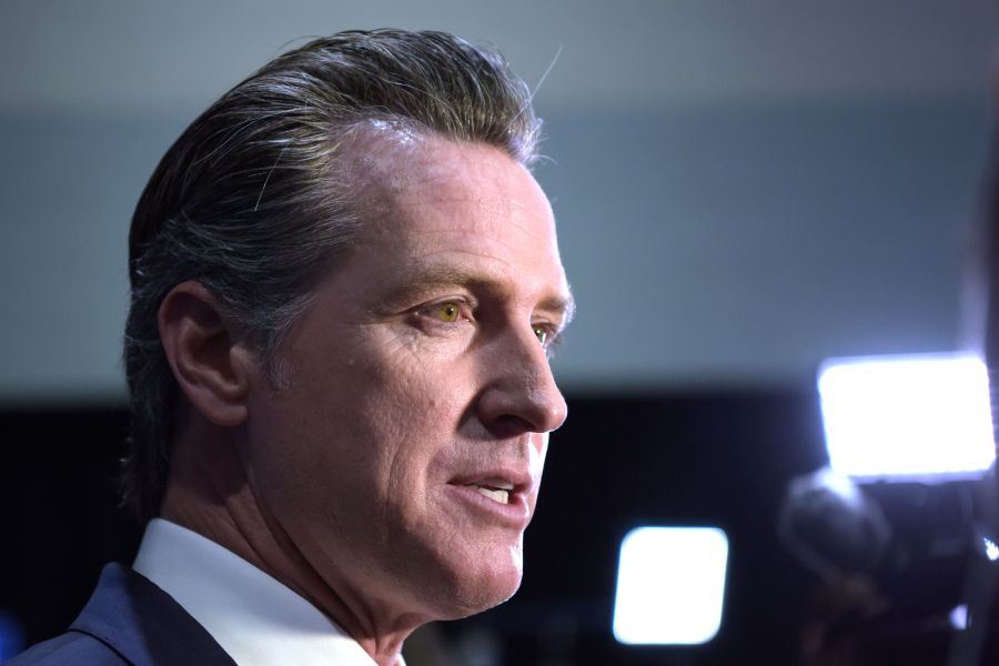 California Governor Gavin Newsom speaks to the press in the spin room at Loyola Marymount University in Los Angeles on Dec. 19, 2019. (AGUSTIN PAULLIER/AFP via Getty Images)