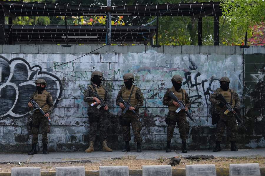 In this picture taken on February 09, 2020, soldiers guard the Legislative Assembly, in San Salvador, as supporters of Salvadoran President Nayib Bukele gather outside it to make pressure on deputies to approve a loan to invest in security. (MARVIN RECINOS/AFP via Getty Images)