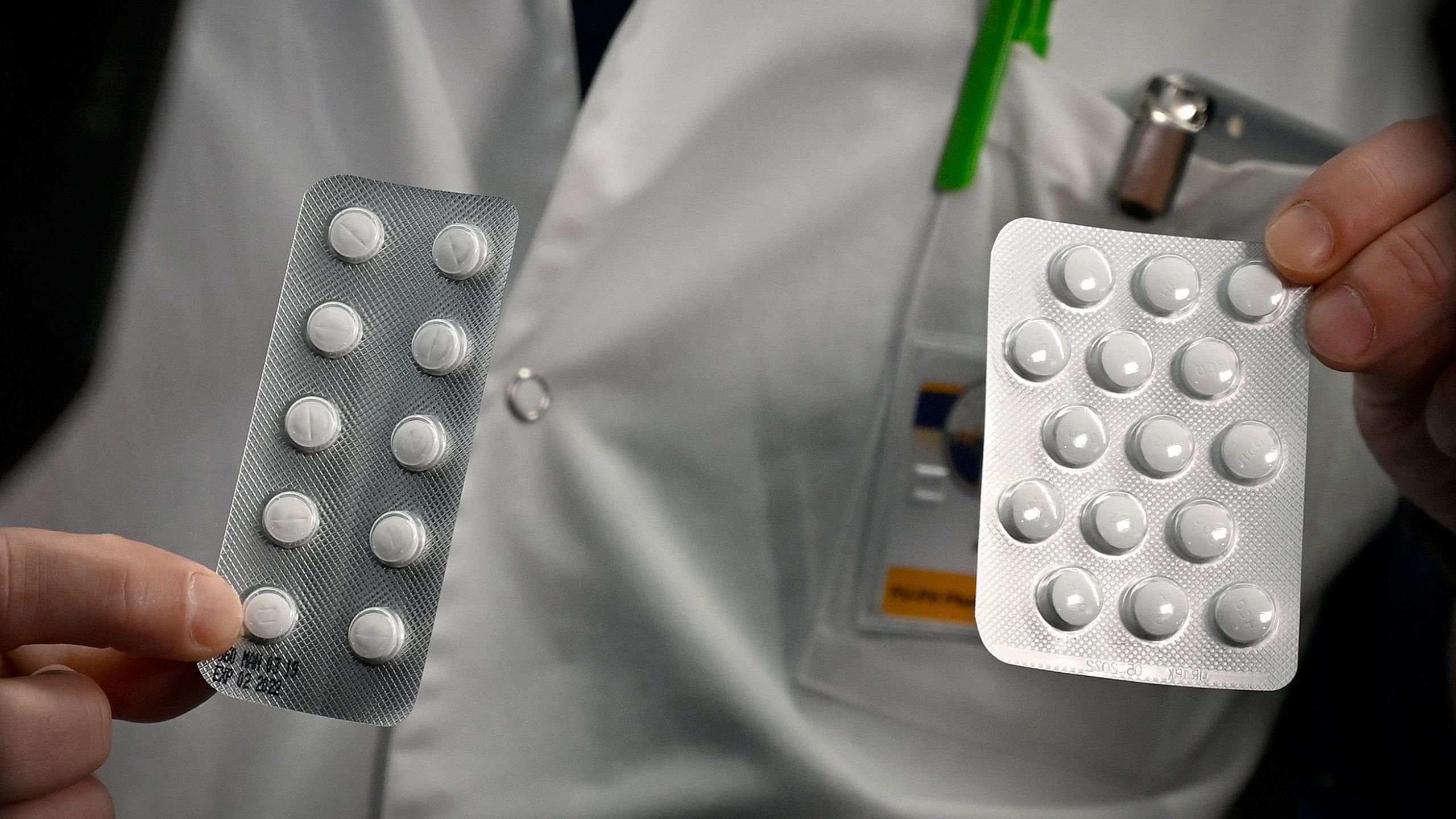 Medical staff shows on February 26, 2020 at the IHU Mediterranee Infection Institute in Marseille, packets of a Nivaquine, tablets containing chloroquine and Plaqueril, tablets containing hydroxychloroquine, drugs that has shown signs of effectiveness against coronavirus. (GERARD JULIEN/AFP via Getty Images)