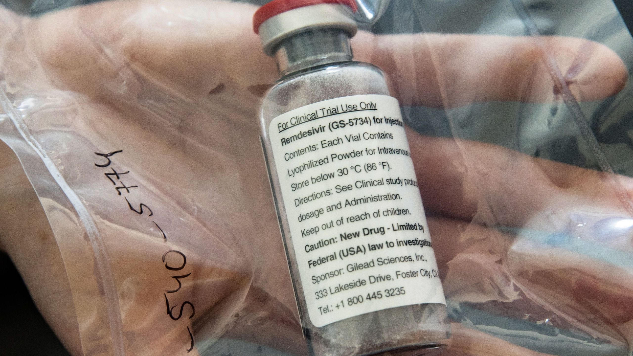 One vial of the drug remdesivir is displayed during a press conference at the University Hospital Eppendorf in Hamburg, northern Germany on April 8, 2020. (ULRICH PERREY/POOL/AFP via Getty Images)