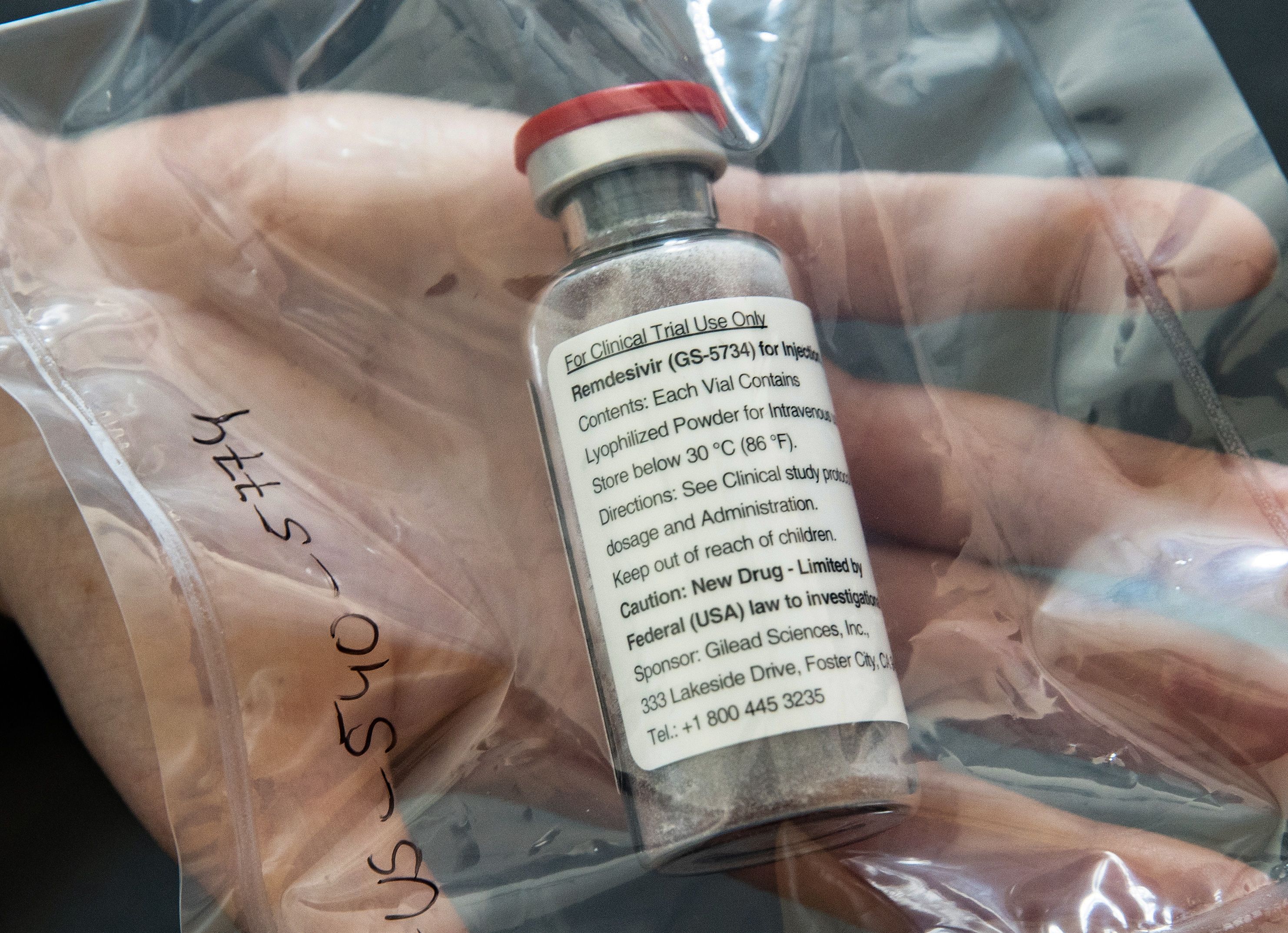 One vial of the drug remdesivir is displayed during a press conference at the University Hospital Eppendorf in Hamburg, northern Germany on April 8, 2020. (ULRICH PERREY/POOL/AFP via Getty Images)