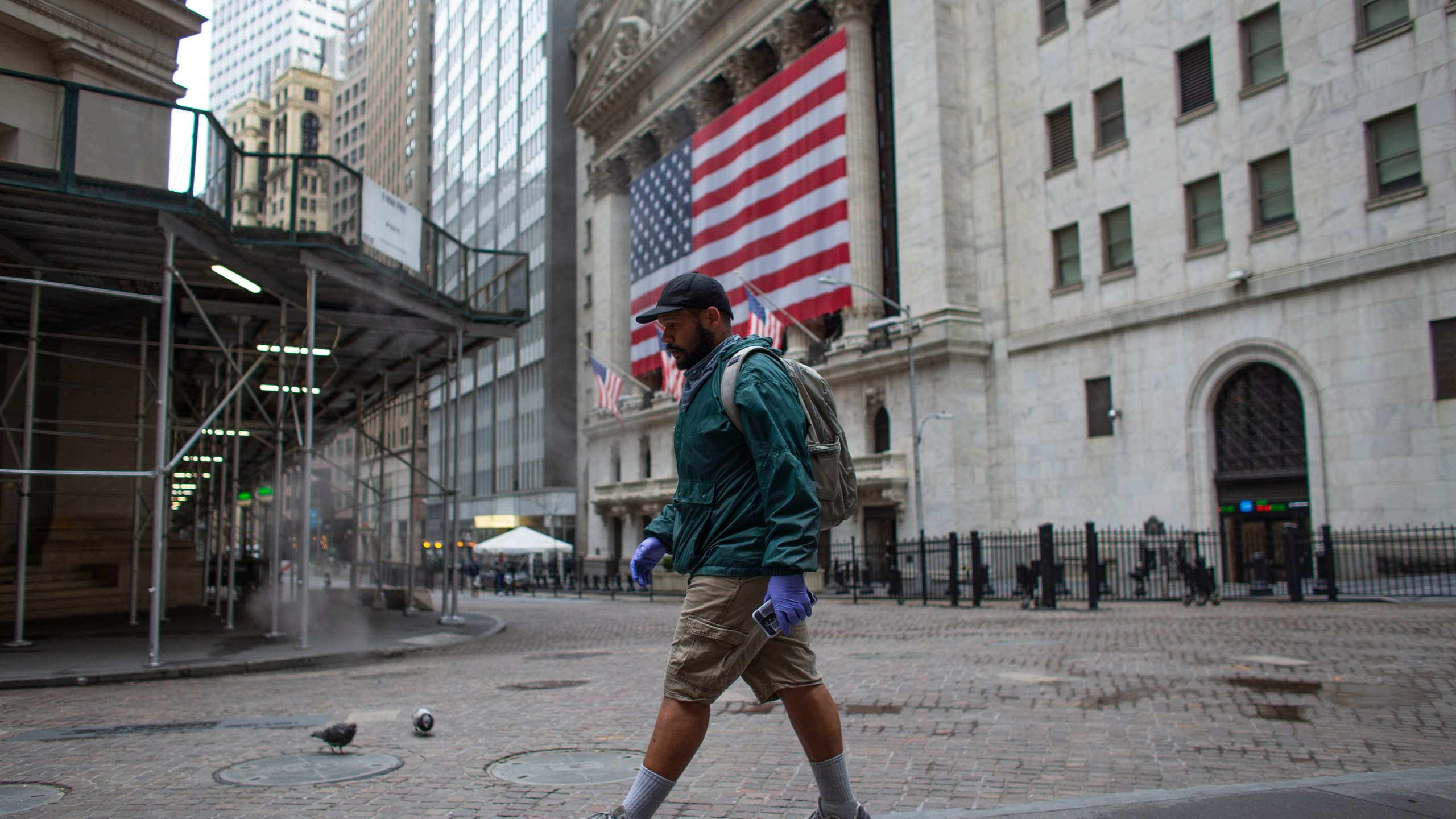 A man walks by the NYSE on April 09, 2020 in New York City. (Kena Betancur/Getty Images)