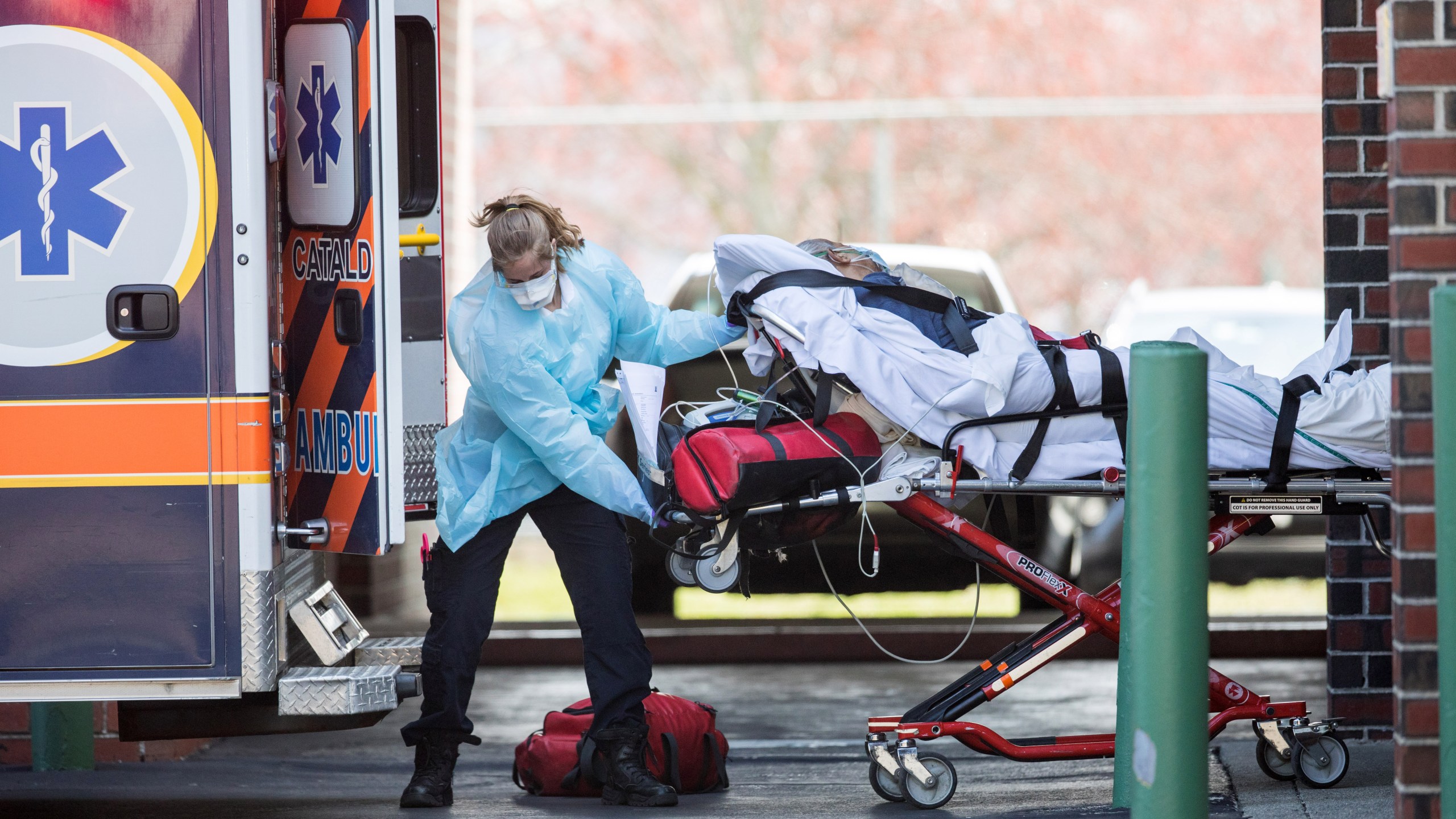 First responders load a patient into an ambulance from a nursing home where multiple people have contracted COVID-19 on April 17, 2020 in Chelsea, Massachusetts. (Scott Eisen/Getty Images)