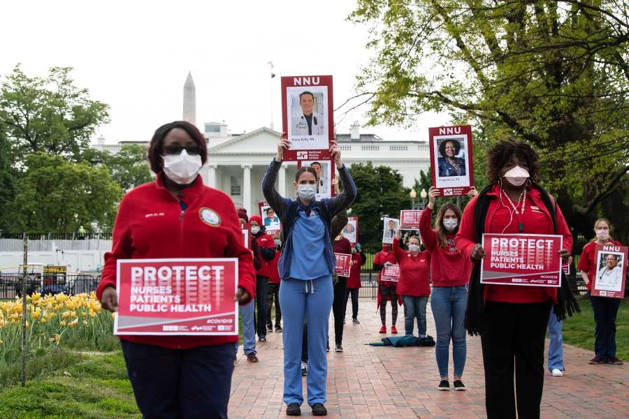 Nurses protest outside the White House against their lack of personal protection equipment on April 21, 2020. (Credit: NICHOLAS KAMM / AFP / Getty Images)