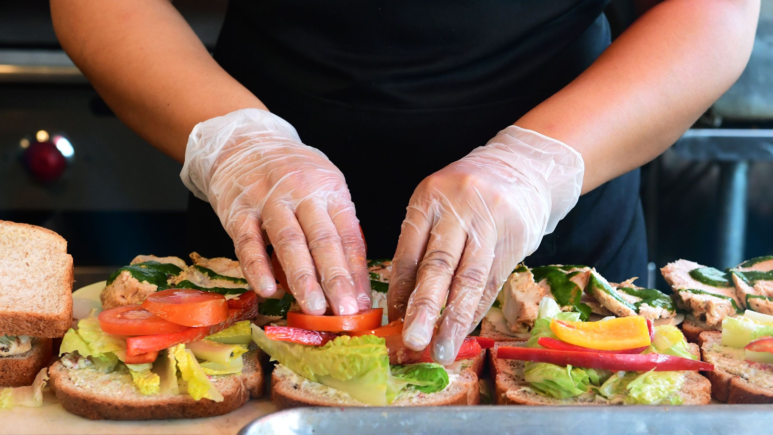 Sandwiches to be donated to medical workers are prepared at the Carvery Kitchen in Santa Monica on April 24, 2020. (Credit: Frederic J. Brown / AFP / Getty Images)