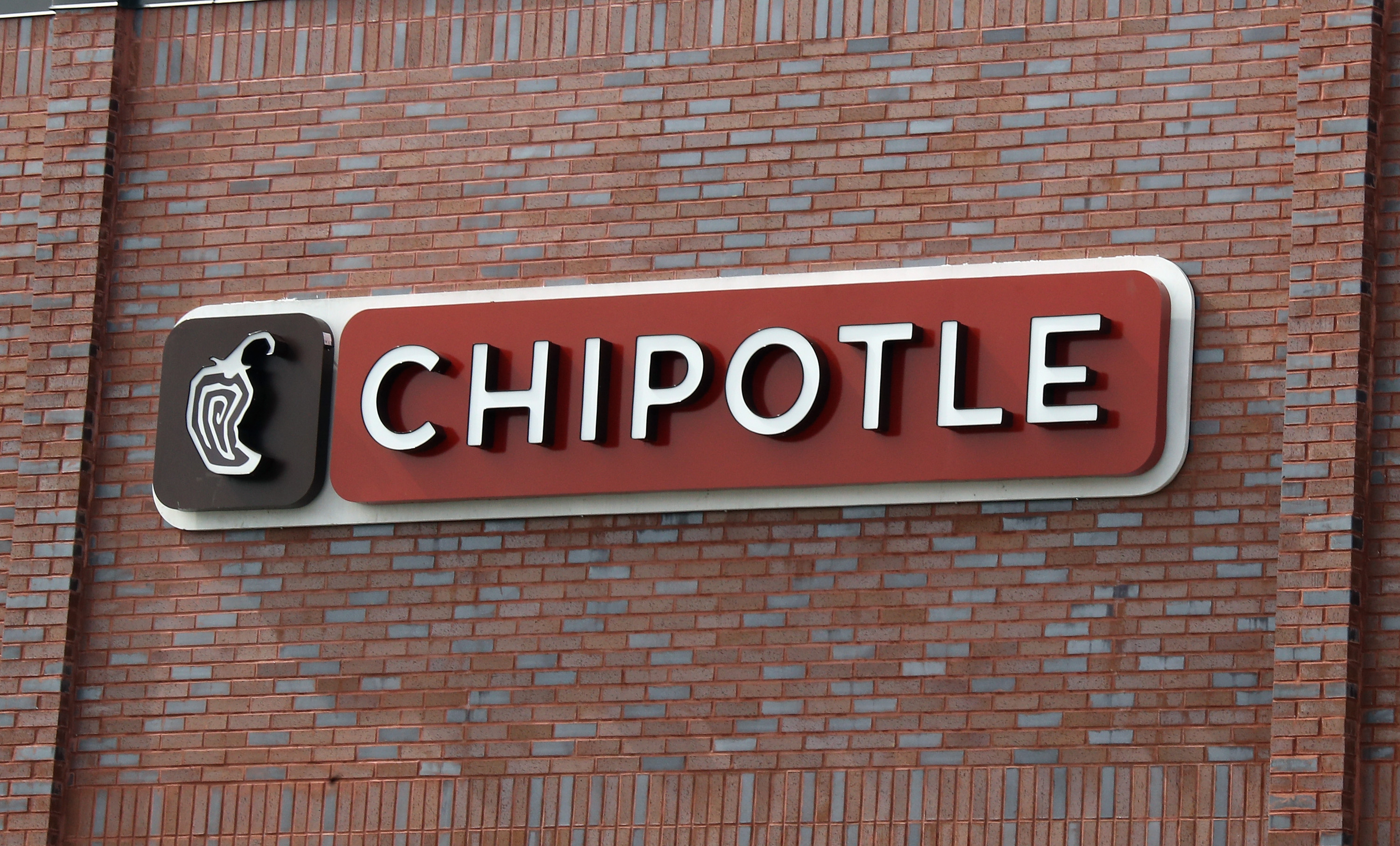 A sign for Chipotle is seen in a file photo. (Bruce Bennett/Getty Images)