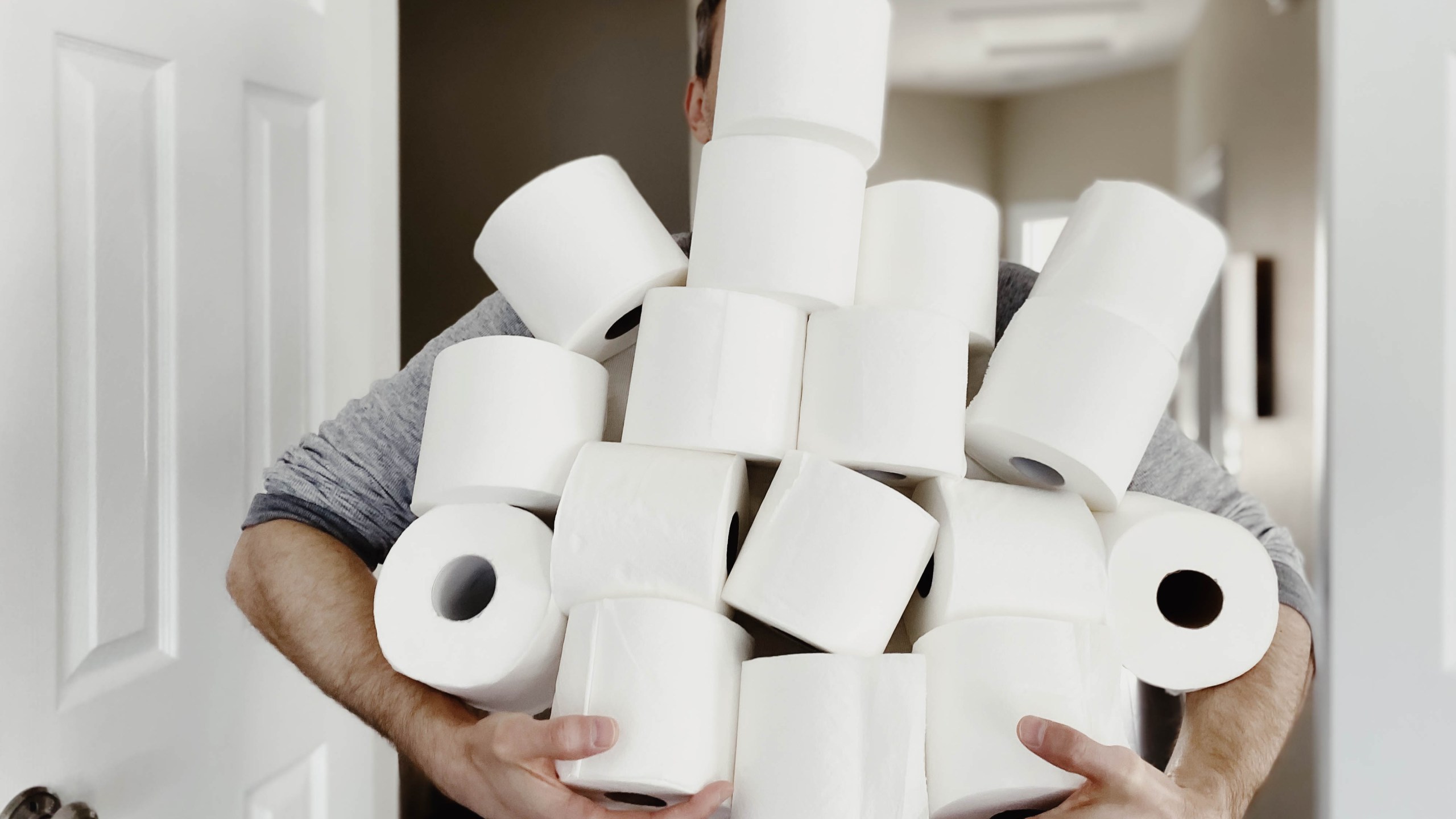 A man carries an abundance of toilet paper in this undated file photo. (Credit: Getty Images)