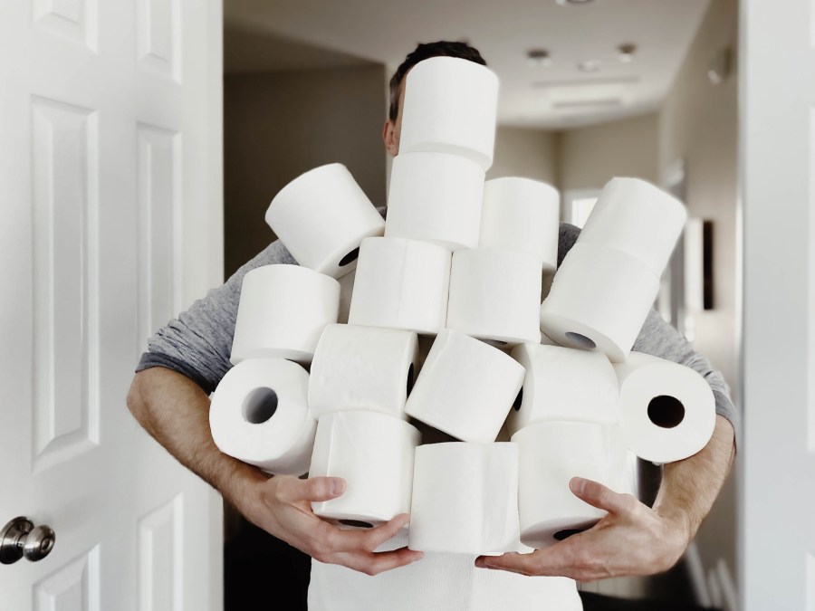 A man carries an abundance of toilet paper in this undated file photo. (Credit: Getty Images)