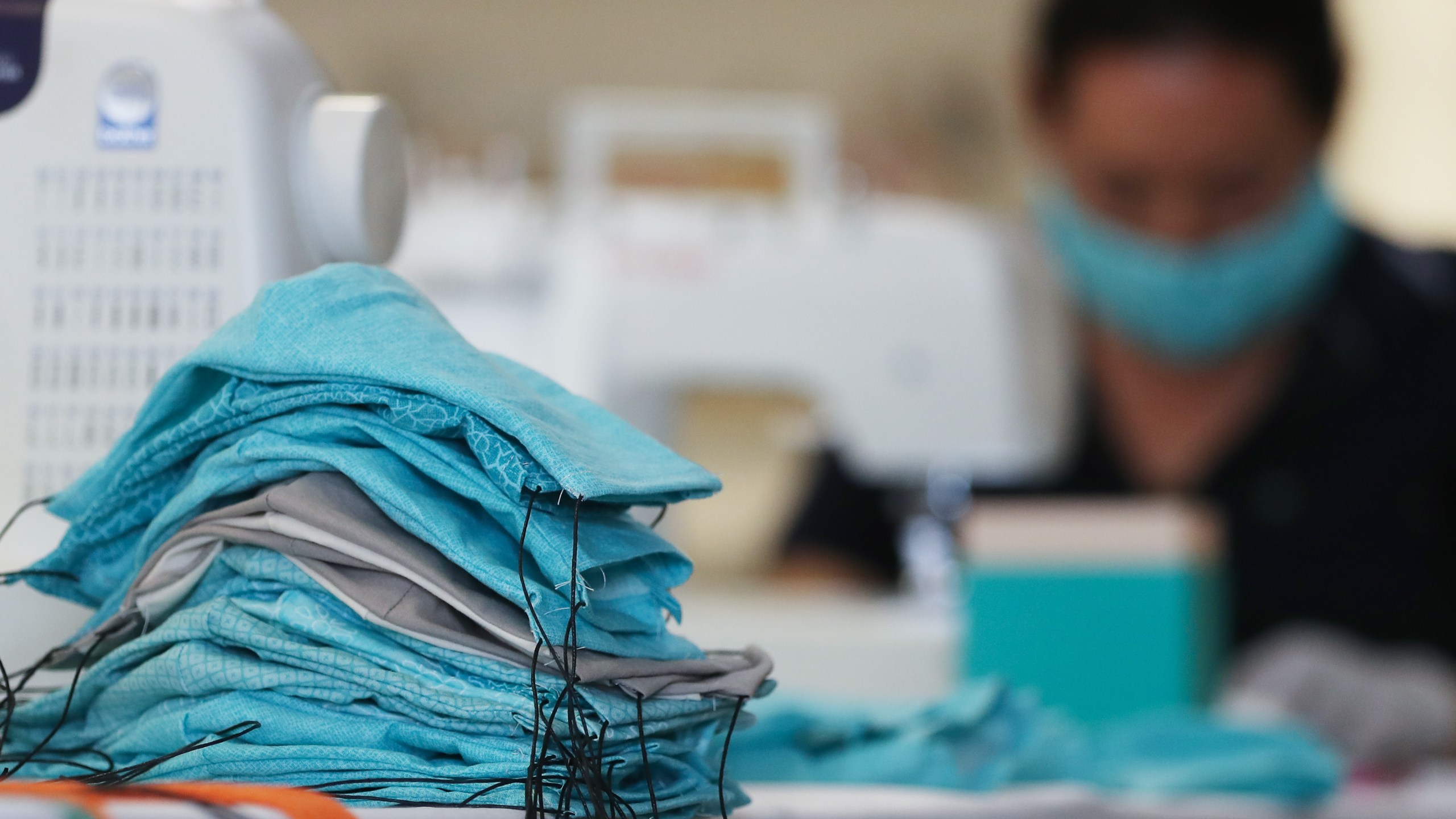 An employee from an L.A.-based shoe company makes masks to be donated to hospitals amid the coronavirus pandemic on March 31, 2020, in Culver City, California. (Mario Tama/Getty Images)