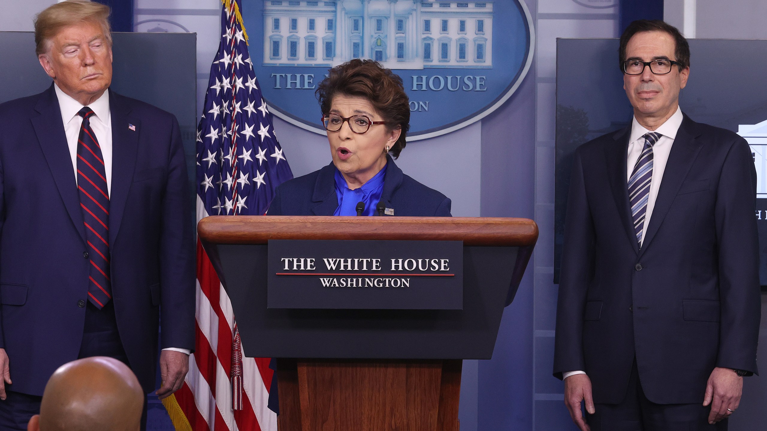 Small Business Administrator Jovita Carranza speaks while flanked by U.S. President Donald Trump and Secretary of Treasury Steve Mnuchin in the press briefing room with members of the White House Coronavirus Task Force on April 2, 2020 in Washington, D.C. (Win McNamee/Getty Images)