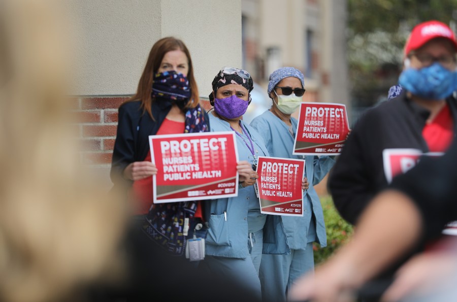 Registered nurses and health care workers protest what they say is a lack of personal protective equipment (PPE) available for frontline workers at UCLA Medical Center, Santa Monica amid the coronavirus pandemic on April 13, 2020, in Santa Monica, California. (Mario Tama/Getty Images)