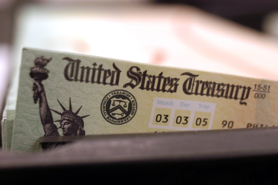 Blank Social Security checks are run through a printer at the U.S. Treasury printing facility February 11, 2005 in Philadelphia, Pennsylvania. (William Thomas Cain/Getty Images)