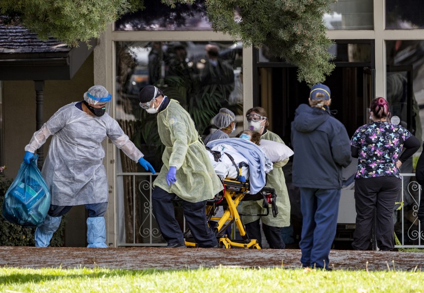 Patients are removed from Magnolia Rehabilitation and Nursing Center in Riverside in April 2020 after dozens tested positive for the coronavirus and staffers, afraid for their safety, stopped showing up for shifts.(Gina Ferazzi / Los Angeles Times)